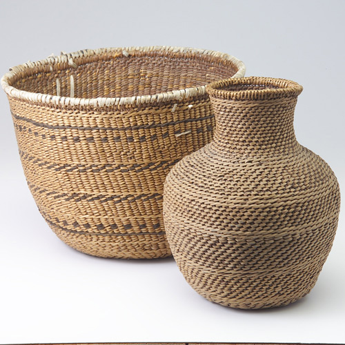 Appraisal: Two raised form baskets Baskets are utilitarian with leather trim