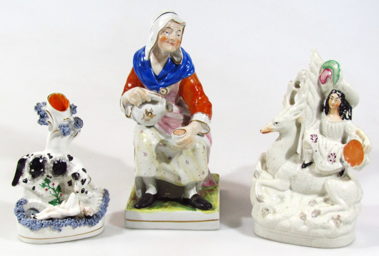 Appraisal: A thC Staffordshire spill vase group of dog saving drowning