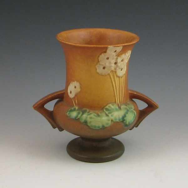 Appraisal: Roseville Primrose handled vase in brown Marked Roseville - Chips