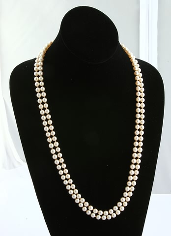 Appraisal: KY Pearl accented clasp Long double strand of mm round