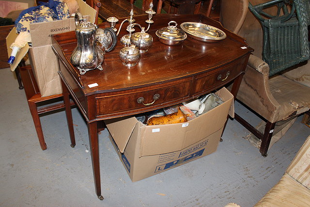 Appraisal: AN EDWARDIAN MAHOGANY BOW FRONTED SIDE TABLE with galleried top