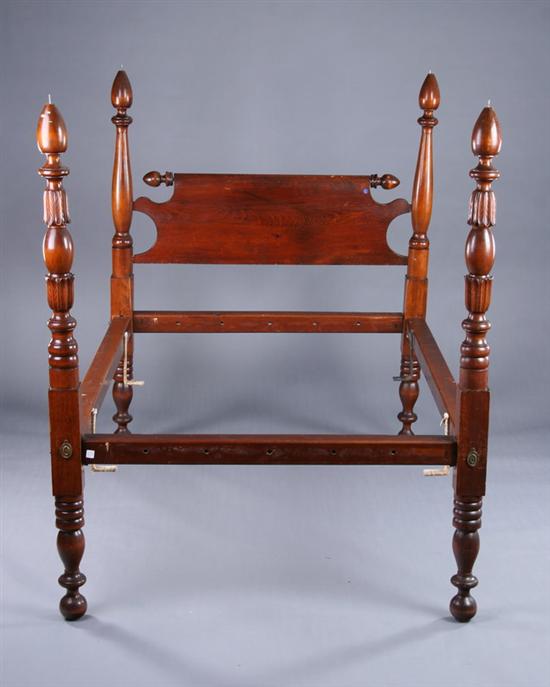 Appraisal: AMERICAN CLASSICAL BED th century walnut Back-scrolled headboard supported by