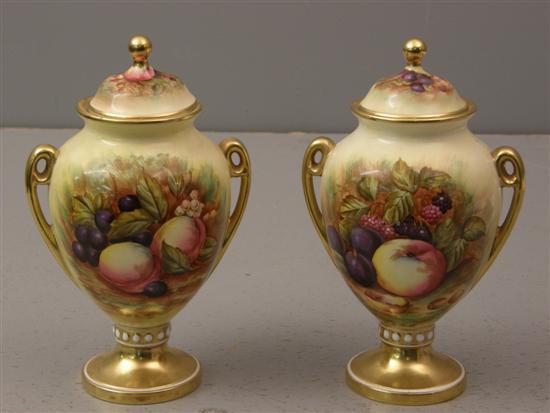 Appraisal: Pair of Aynsley vases and covers decorated with fruit highlighted