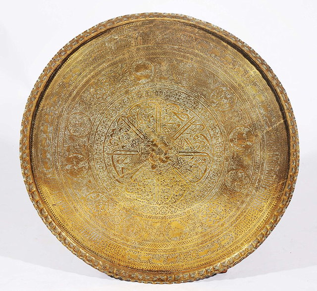 Appraisal: A LARGE PERSIAN ENGRAVED BRASS TRAY with Islamic text panels