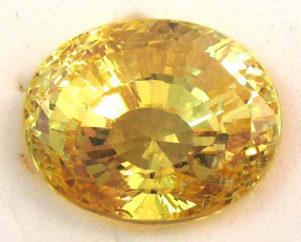 Appraisal: AN UNSET YELLOW SAPPHIRE modified oval mixed-cut weighing cts and