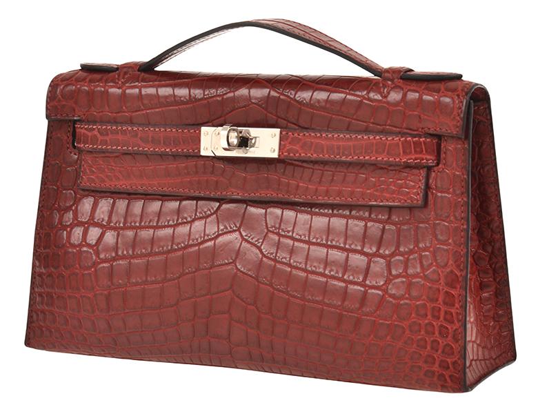 Appraisal: A CROCODILE KELLY POCHETTE BY HERMES The cm bag styled