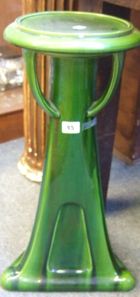 Appraisal: A Bretby green tin-glaze pottery jardiniere stand of Arts Crafts