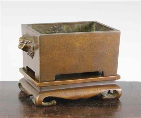 Appraisal: A Chinese bronze rectangular censer and stand with lion mask