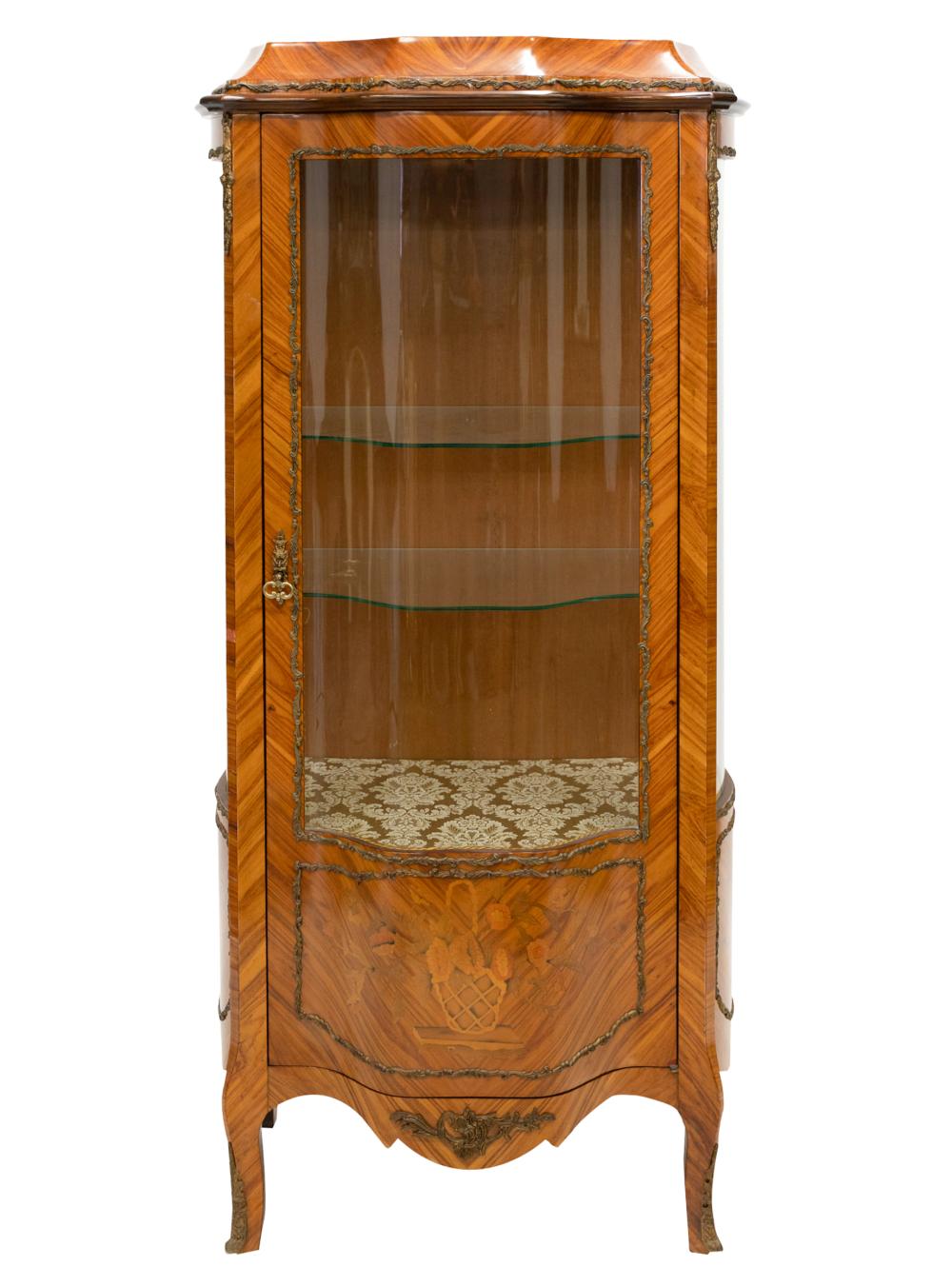 Appraisal: GILT METAL-MOUNTED VITRINEwith faux marquetry decoration and two glass shelves