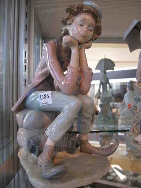 Appraisal: LLADRO FIGURE OF A SEATED BOY WITH SQUEEZE BOX