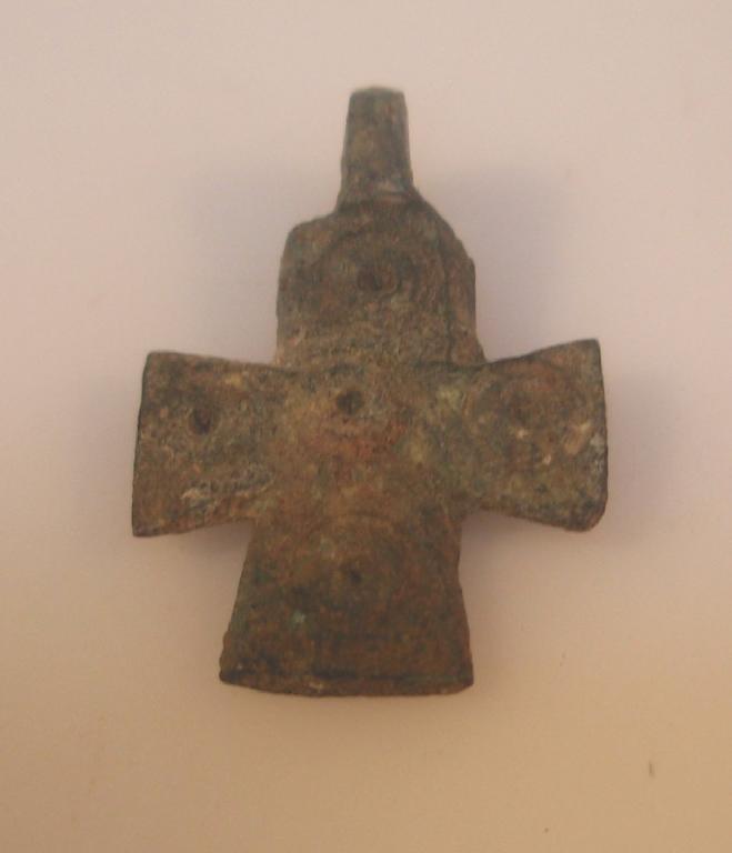 Appraisal: A Byzantine bronze cross pendant with a suspension loop and