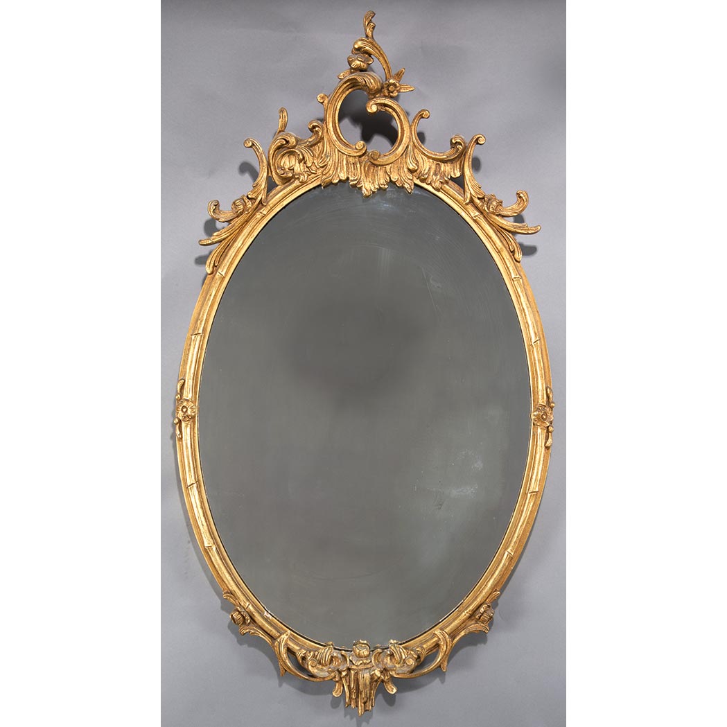 Appraisal: Louis XVI Style Giltwood Mirror The oval mirror plate surmounted