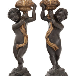 Appraisal: A Pair of Gilt and Patinated Bronze Figures of Cherubs