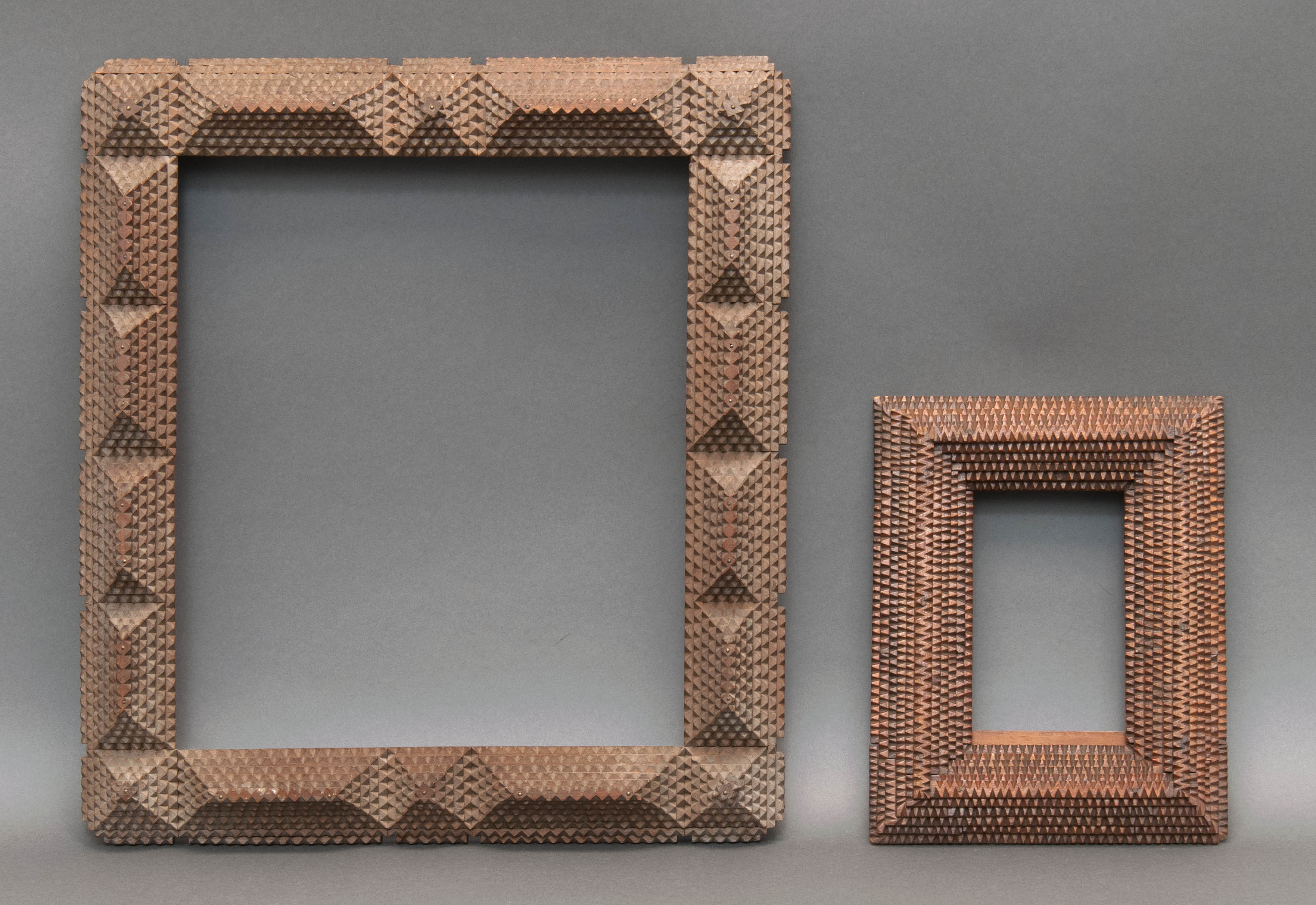 Appraisal: TWO TRAMP ART FRAMES Early th CenturyWith tiered geometric carvings