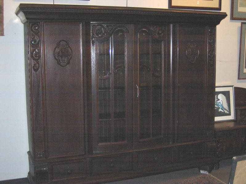 Appraisal: CONTINENTAL TH CENTURY OAK DISPLAY CABINET Overhanging pediment with egg