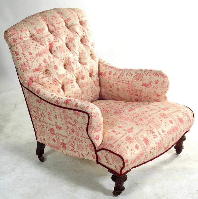 Appraisal: VICTORIAN DEEP-BUTTONED LADY'S ARMCHAIR with outscrolled arms raised on turned