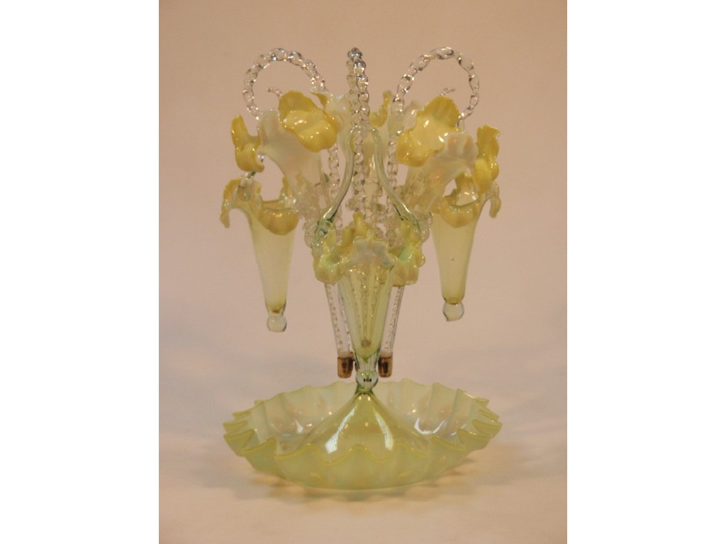 Appraisal: A Victorian Vaseline glass epergne with three trumpet vases and