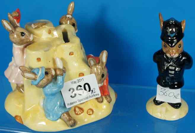 Appraisal: Royal Doulton Bunnykins Sandcastle Moneybox DB and Policeman Bunnykins DB