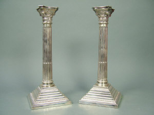 Appraisal: A pair of silver corinthean column table candlesticks with stop