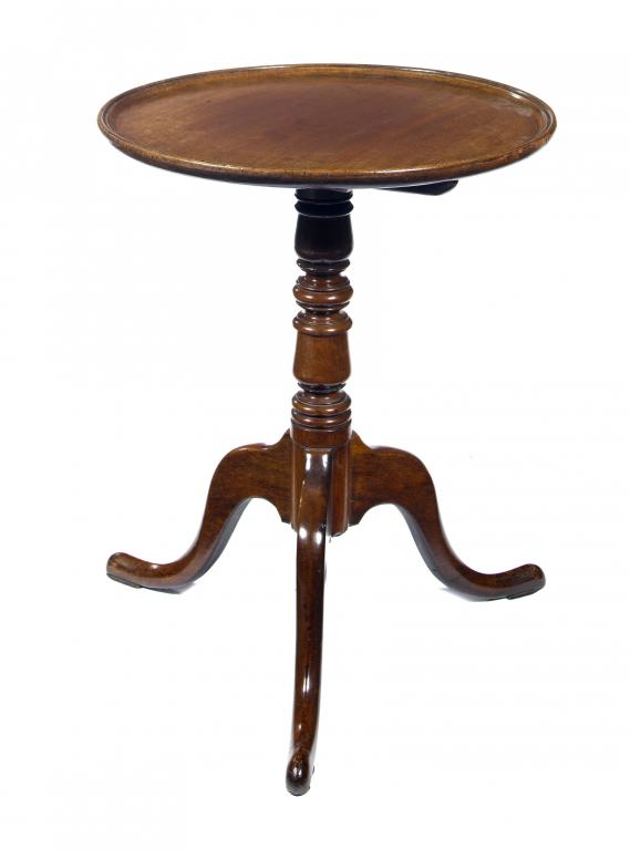 Appraisal: A GEORGE III MAHOGANY TRIPOD TABLE the dished top on