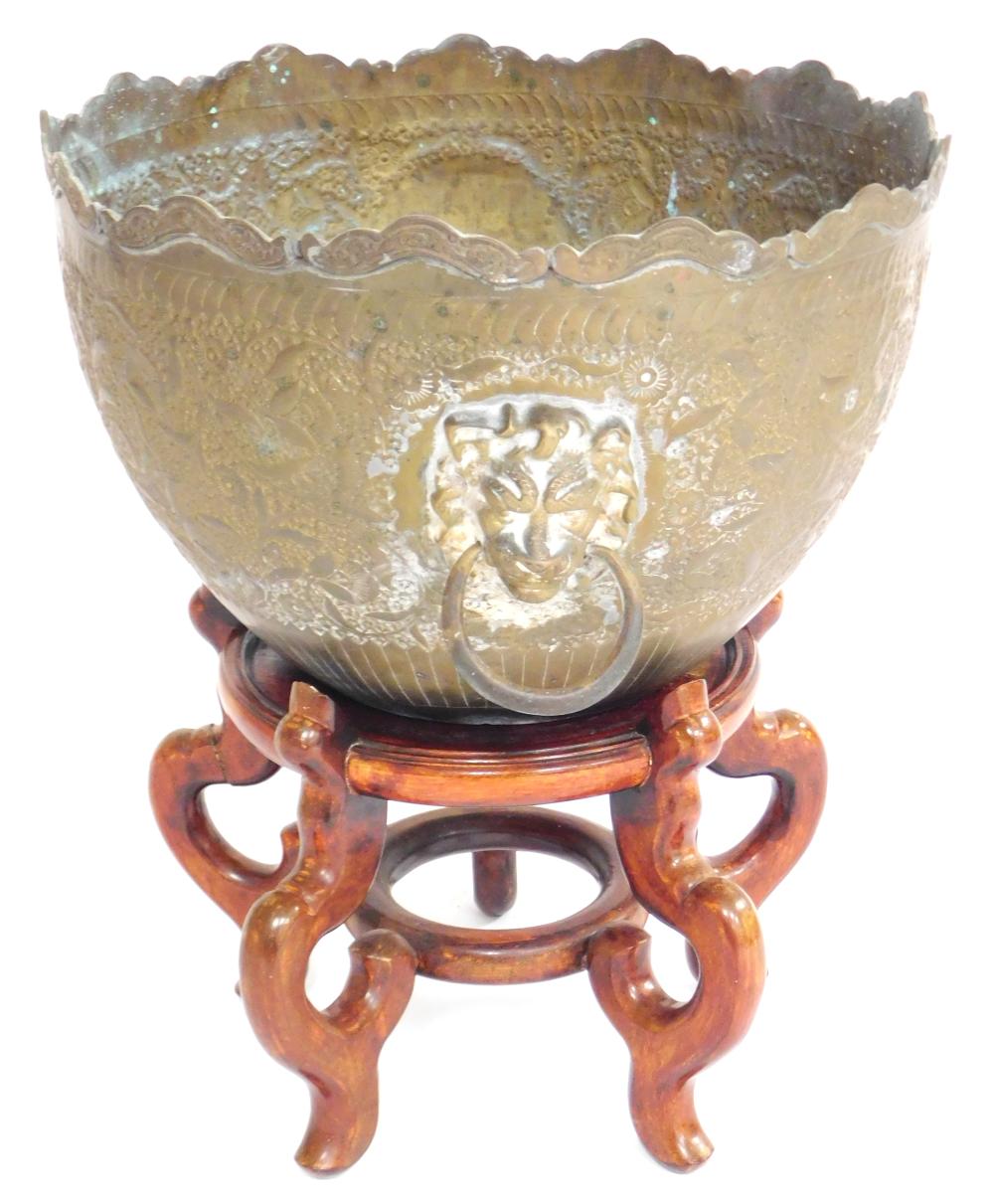 Appraisal: ASIAN Brass planter and five-legged wooden stand planter decorated with