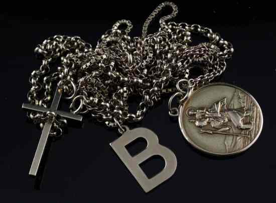 Appraisal: Three ct gold chains hung with initial B cross and