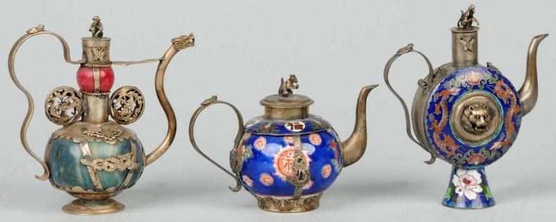 Appraisal: Lot of Early Oriental Miniature Tea Servers Description Late s