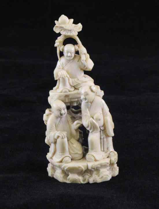 Appraisal: A Chinese ivory group early th century each seated on