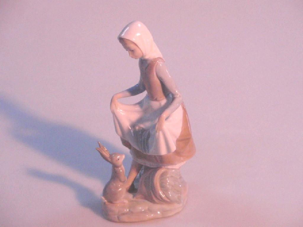 Appraisal: A Lladro figure of a country girl with a hare