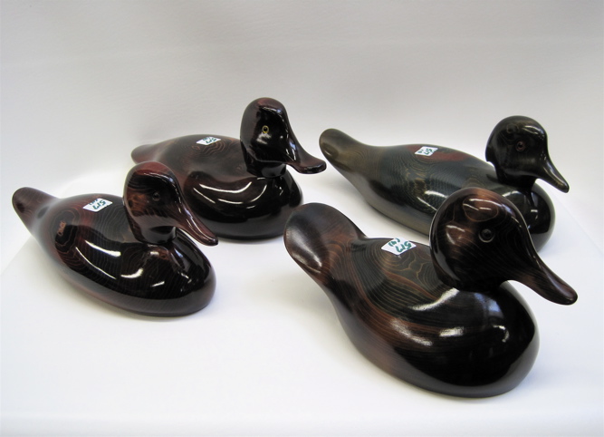 Appraisal: FOUR HAND CARVED WOODEN DUCK DECOYS two by Valerie Bundy