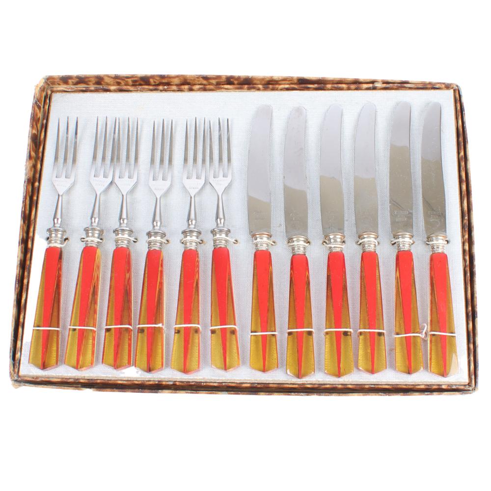 Appraisal: LUNCHEON CUTLERY SET WITH APPLE JUICE AND RED GEOMETRIC BAKELITE