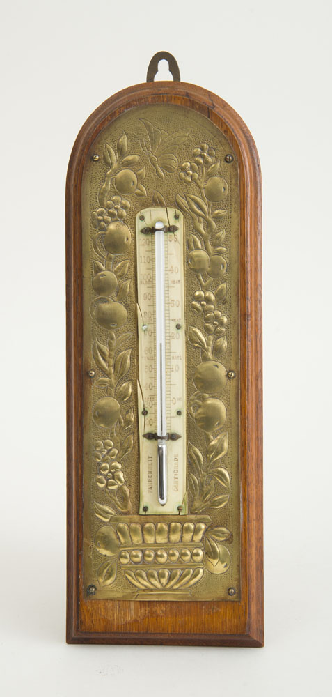 Appraisal: AESTHETIC MOVEMENT BRASS AND OAK THERMOMETER With repouss decoration circa