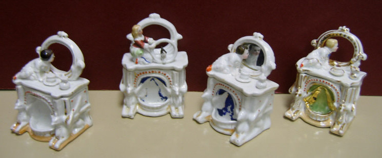 Appraisal: FOUR VICTORIAN PORCELAIN DRESSER BUREAU BOXES Each vanity form with