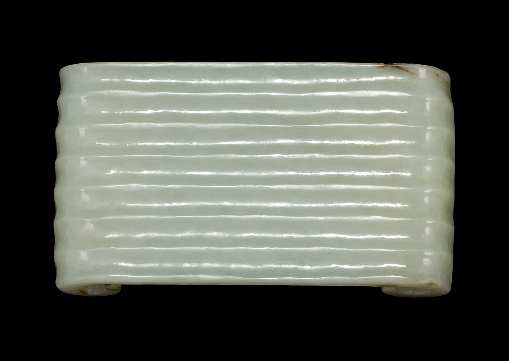 Appraisal: JADE WRIST REST th CenturyIn ribbed scroll form Length cm