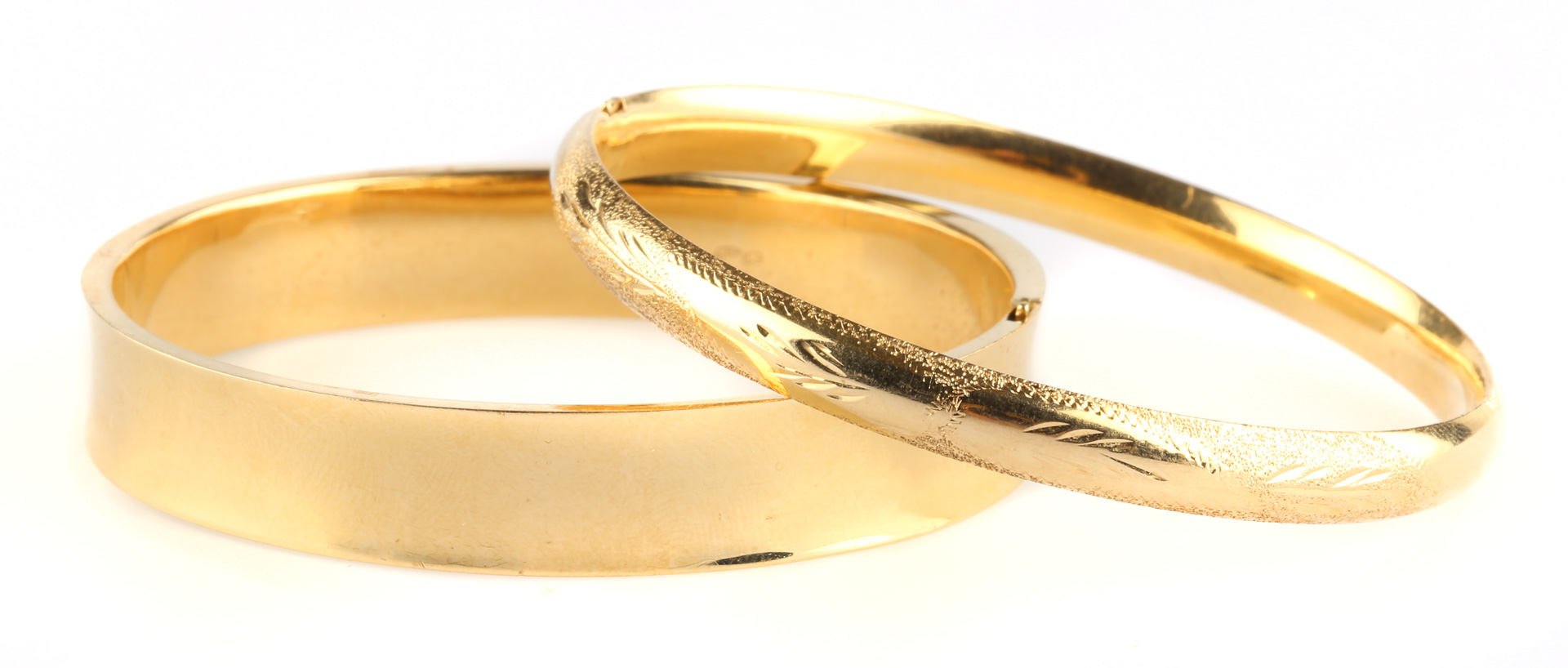 Appraisal: A Pair of Gold Bangle Bracelets K engraved hinge opening