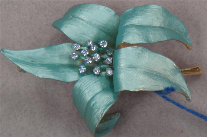 Appraisal: Stunning blue enamel flower pin with blue rhinestone stigma Estimate