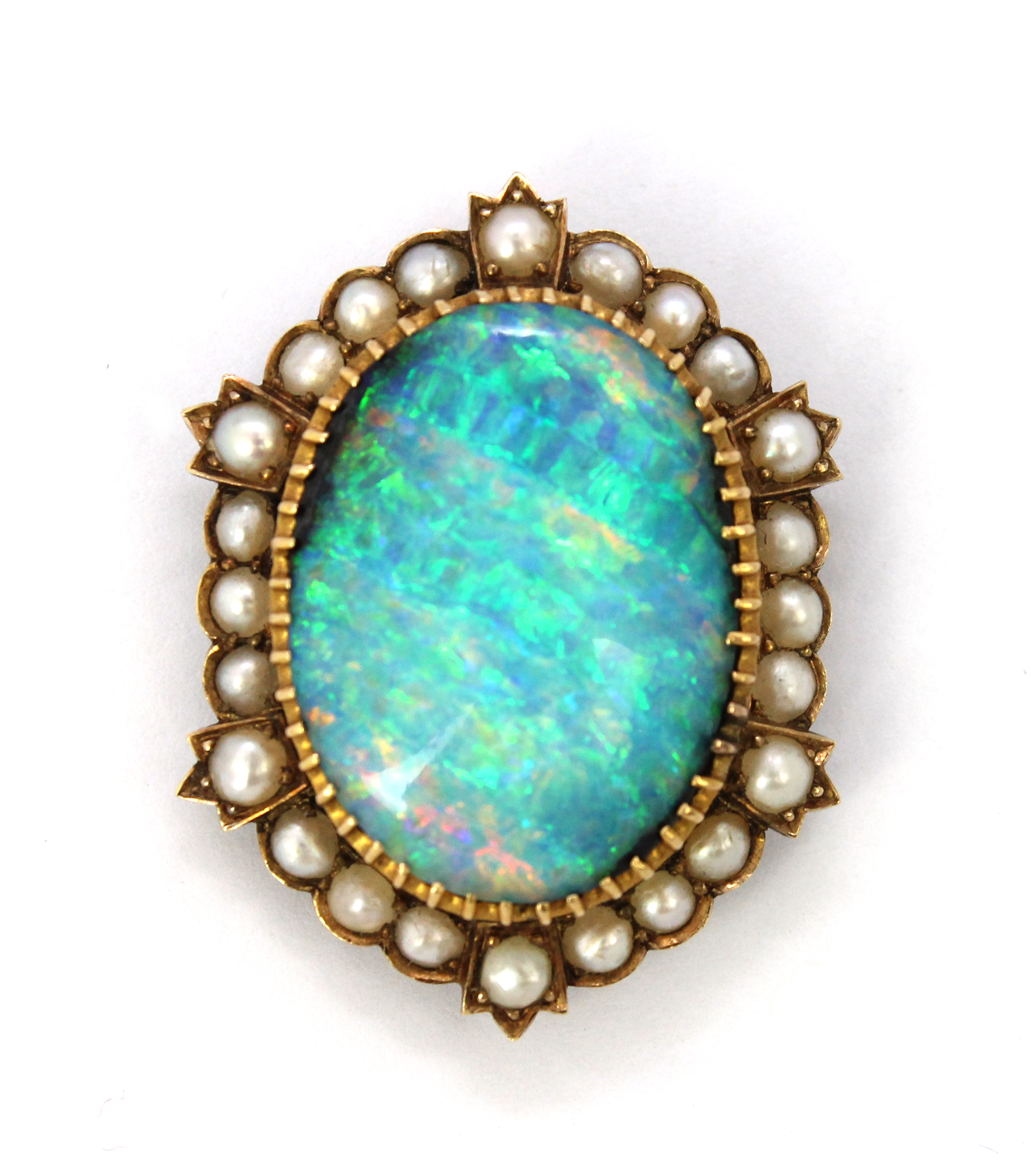 Appraisal: A gold opal and half pearl set shaped oval pendant