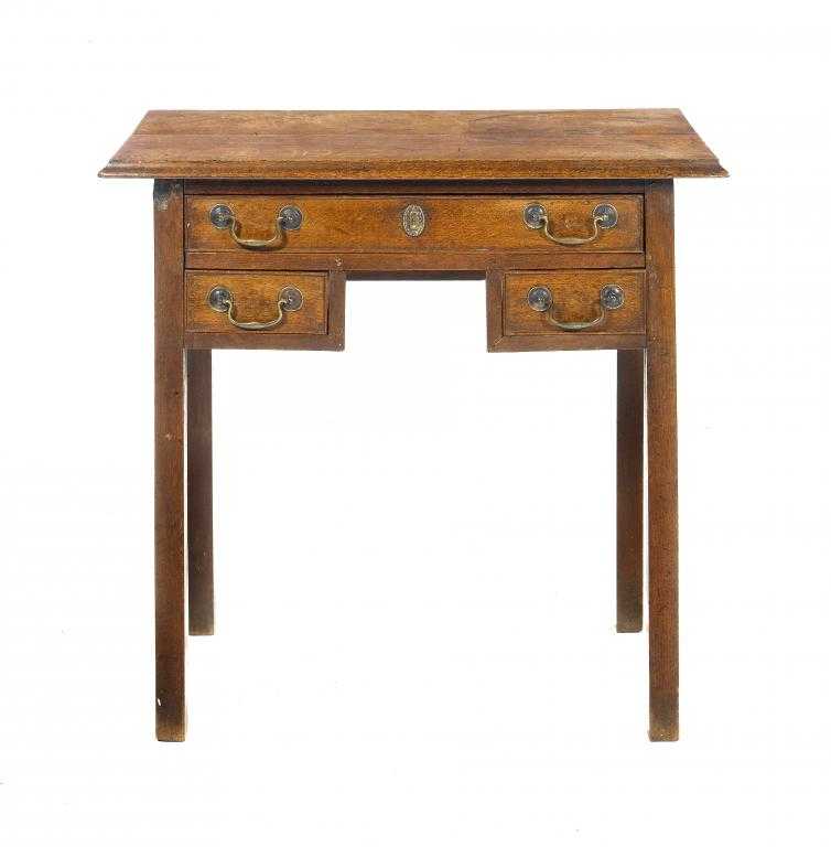 Appraisal: A GEORGE III OAK LOWBOY with quarter sawn moulded top