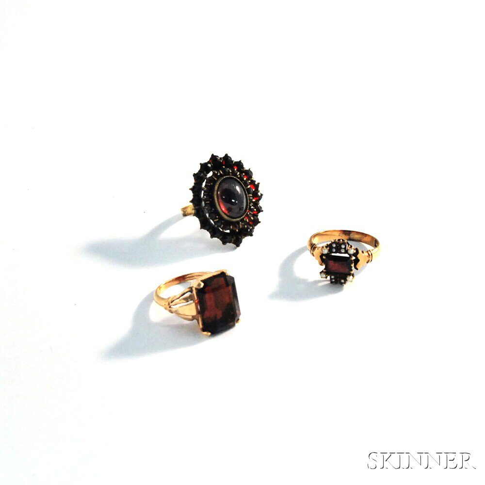 Appraisal: Three Garnet Rings a kt gold ring with a large