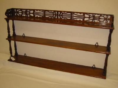 Appraisal: A VICTORIAN WALNUT BRACKET SHELF of oblong three tier form