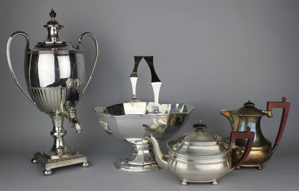 Appraisal: ENGLISH SILVER TEAPOT AND MATCHING HOT MILK POT A SILVERPLATED