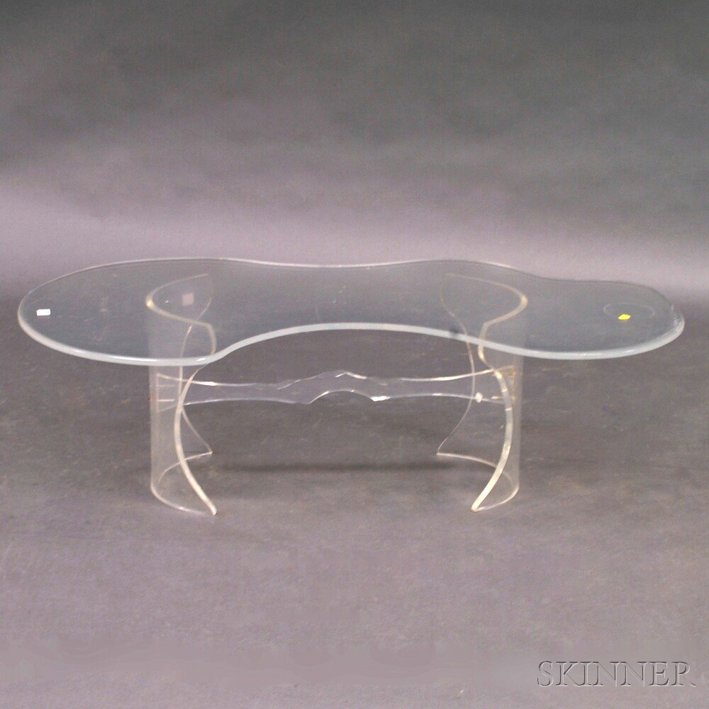 Appraisal: Modern Lucite Coffee Table the asymmetrical top raised on convex