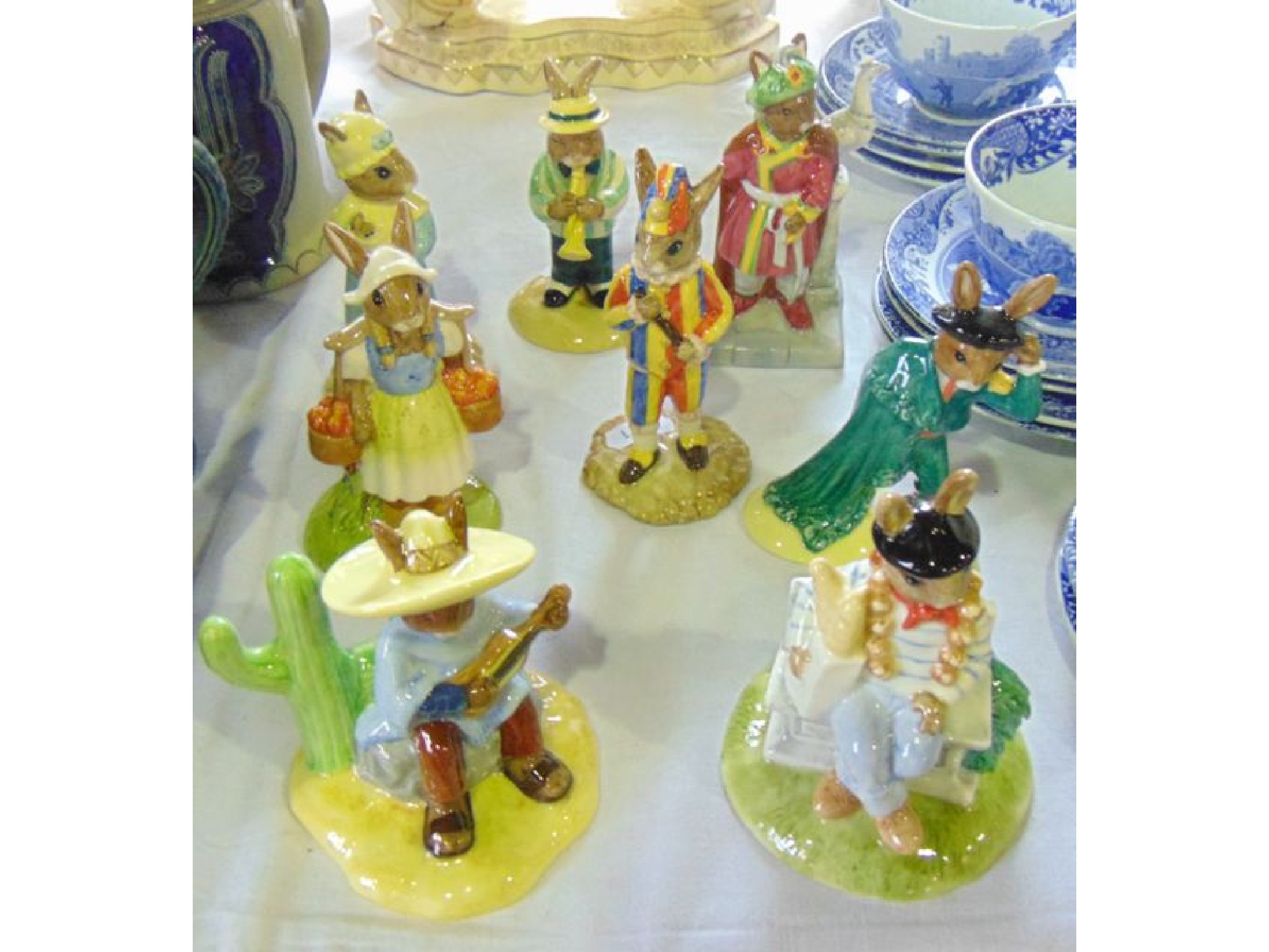 Appraisal: A collection of eight Royal Doulton Bunnykins figures comprising Parisian