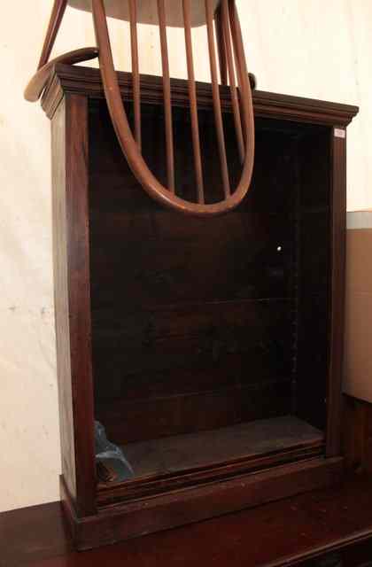 Appraisal: A DARKWOOD DWARF BOOKCASE with adjustable shelves and standing on