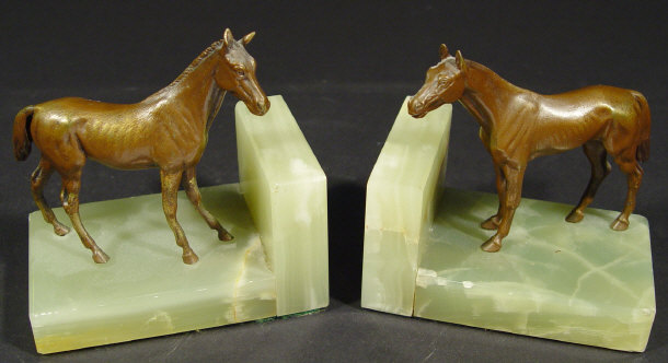 Appraisal: Pair of Austrian cold painted bronze horses mounted onto green