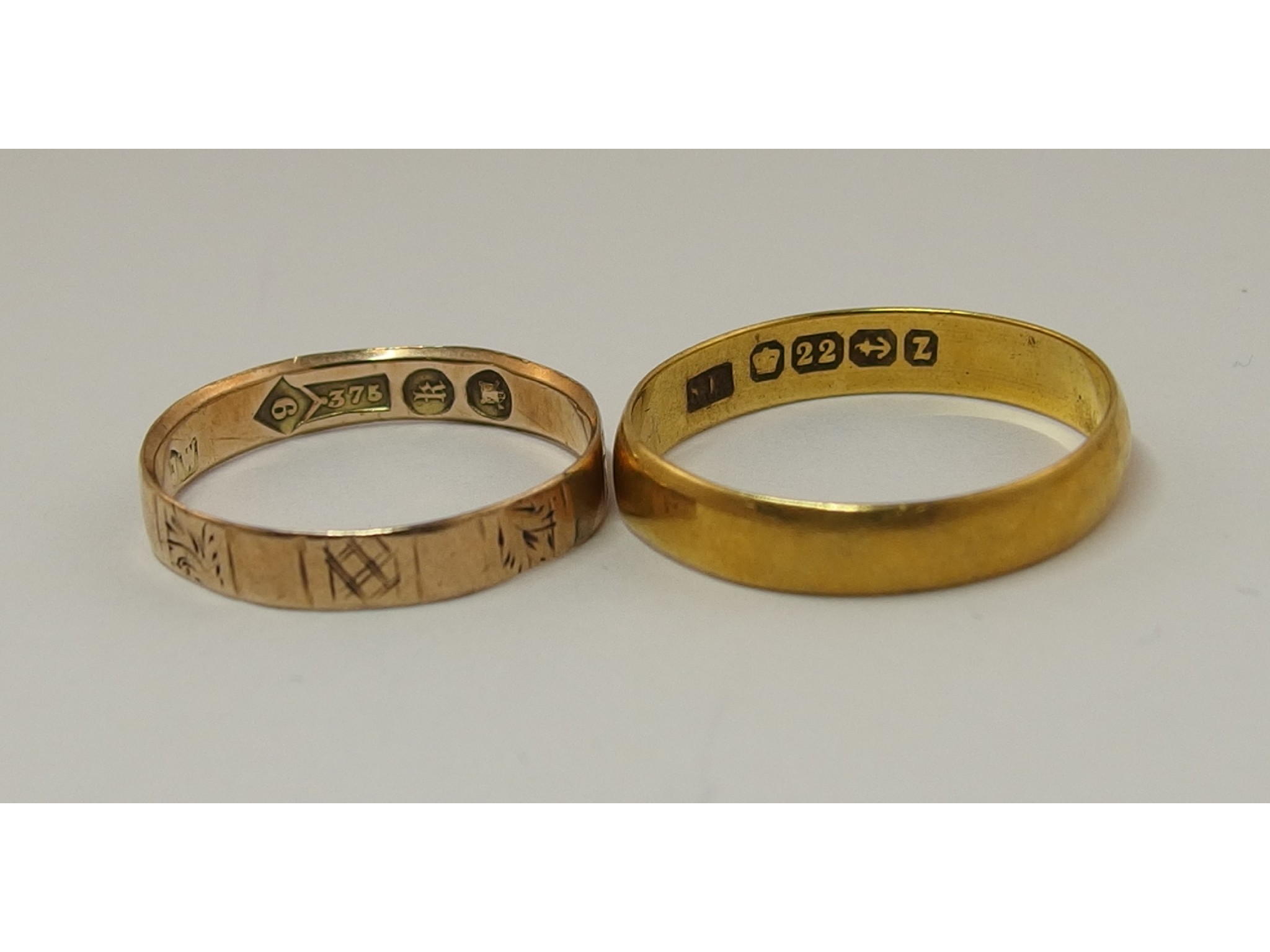 Appraisal: A ct wedding band together with a Victorian ct example