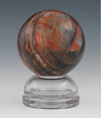 Appraisal: A Petrified Wood Planetary Sphere Visible wood grain polished mineral