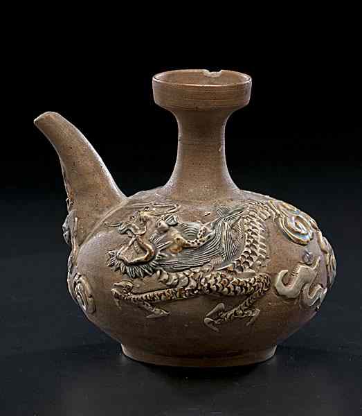 Appraisal: Chinese Dragon Vase Chinese a stoneware vase with carved dragon