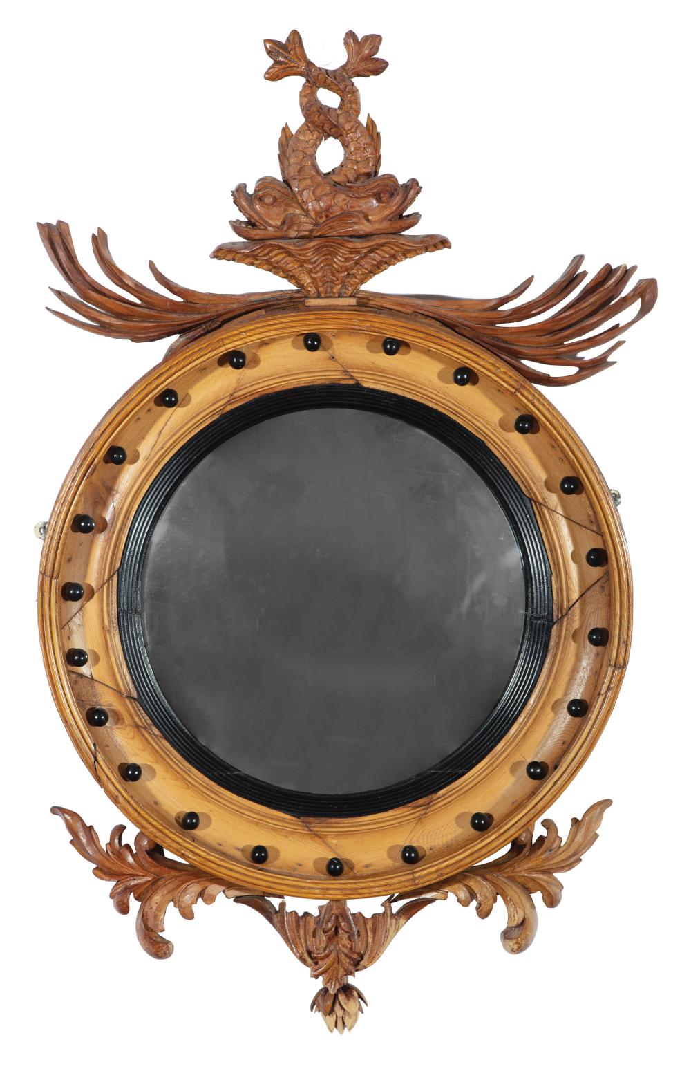 Appraisal: Georgian-Style Carved Pine Bullseye Mirror surmounted by entwined dolphins and