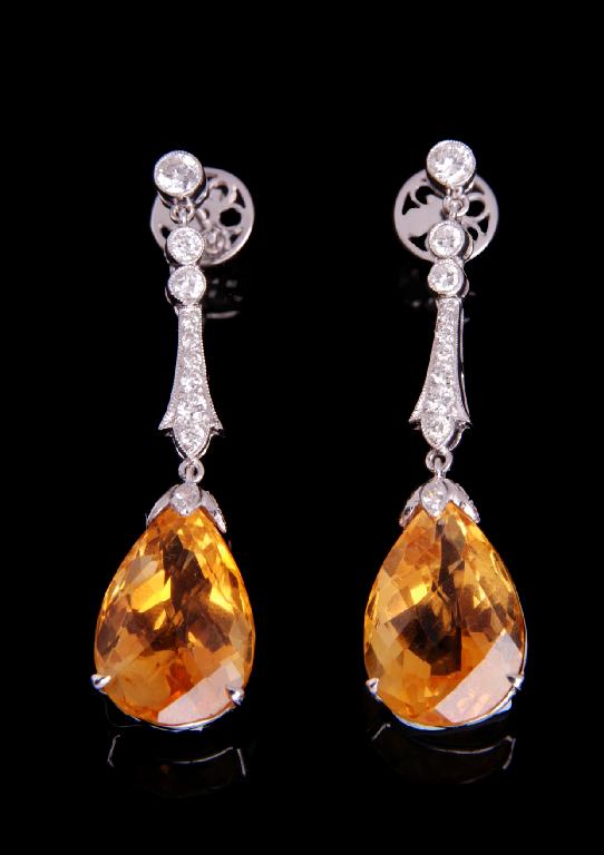 Appraisal: A PAIR OF DIAMOND AND CITRINE EARRINGS of pendant design